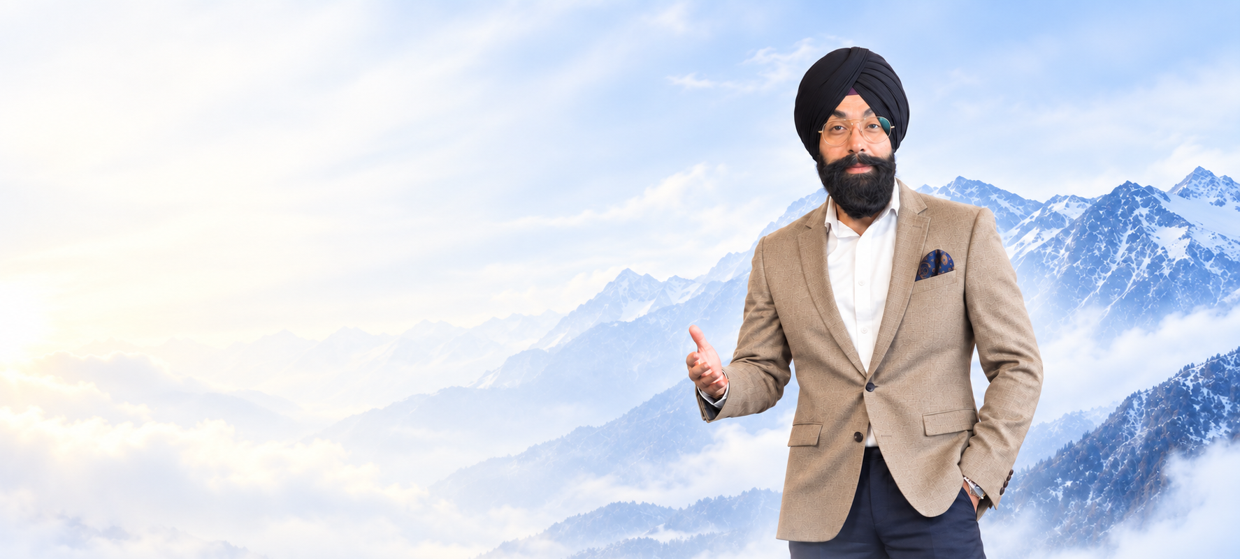 Navdeep Chhabra speaking on stage in a beige blazer.